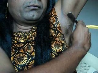 Indian girl shaving armpits hair by strai .