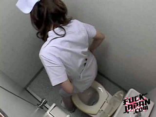 Sexy Japanese brunette masturbates hairy pussy on toilet